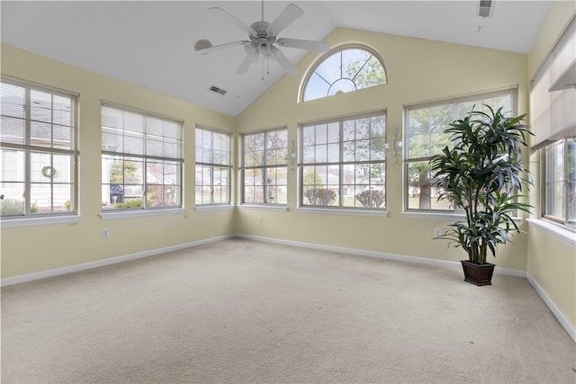 unfurnished sunroom with ceiling fan and lofted ceiling