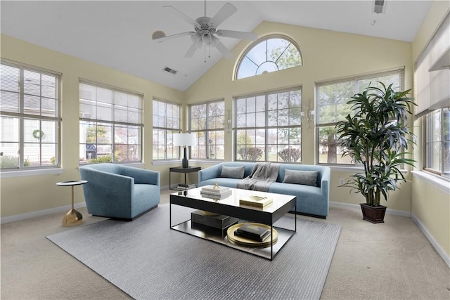 sunroom with ceiling fan and vaulted ceiling