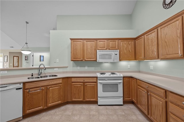 kitchen with sink, high vaulted ceiling, hanging light fixtures, and white appliances