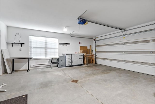 garage featuring a garage door opener and baseboard heating