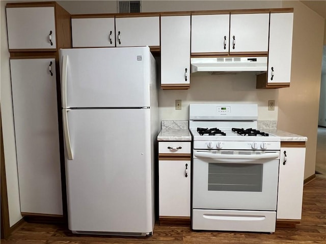 kitchen featuring white cabinets, white appliances, and dark wood-type flooring