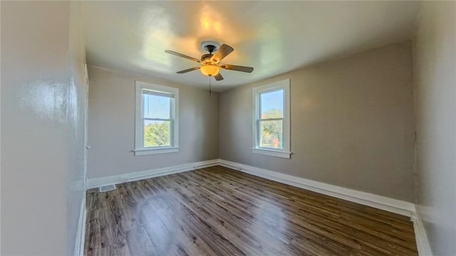 spare room featuring hardwood / wood-style floors and ceiling fan