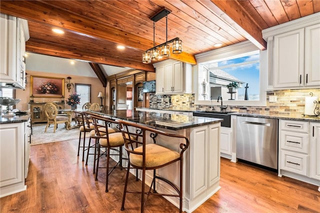 204 S Links Ave, Twp Of But Nw, PA 16001 - kitchen featuring dishwasher, a sink, wooden ceiling with exposed beams, tasteful backsplash, and a breakfast bar area