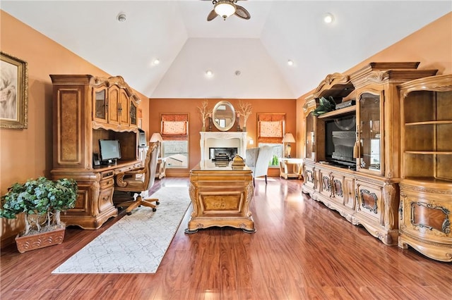 office space with wood-type flooring, vaulted ceiling, and ceiling fan