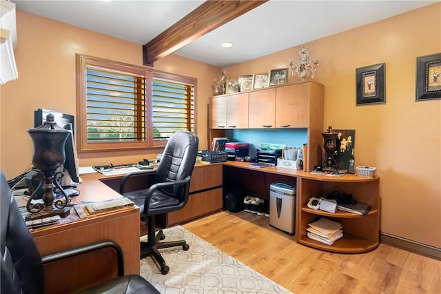 office space with beamed ceiling and light hardwood / wood-style floors