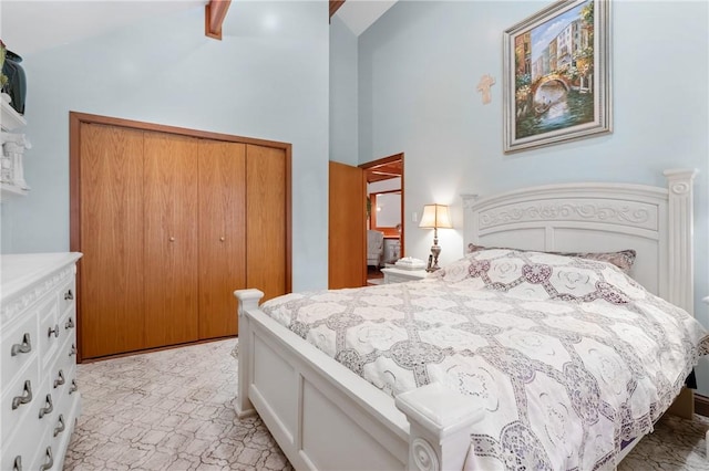 bedroom with high vaulted ceiling, a closet, and ceiling fan