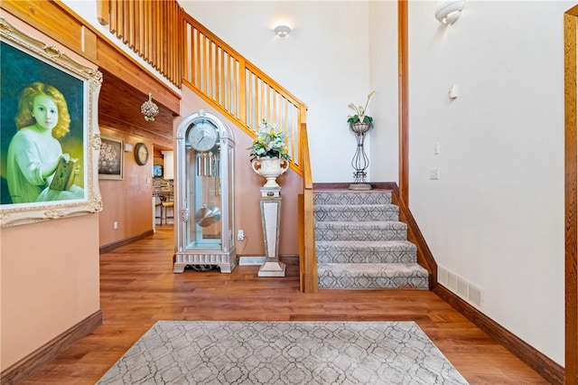 stairs featuring wood-type flooring