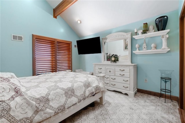 bedroom with vaulted ceiling with beams