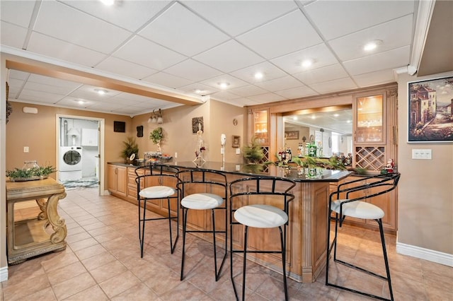204 S Links Ave, Twp Of But Nw, PA 16001 - indoor wet bar featuring washer / clothes dryer, a paneled ceiling, baseboards, light tile patterned floors, and recessed lighting