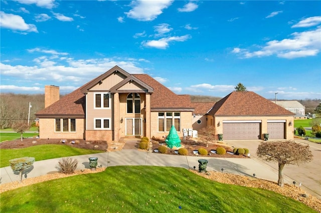 view of front of house featuring a front yard and a garage