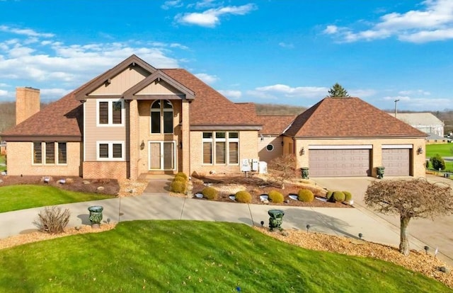 204 S Links Ave, Twp Of But Nw, PA 16001 - traditional home featuring a front yard, a garage, a chimney, and driveway