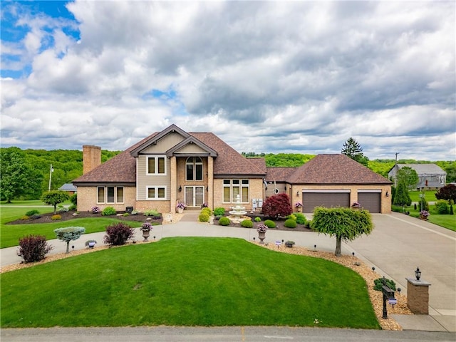 204 S Links Ave, Twp Of But Nw, PA 16001 - traditional home with a garage, a front lawn, a chimney, concrete driveway, and brick siding