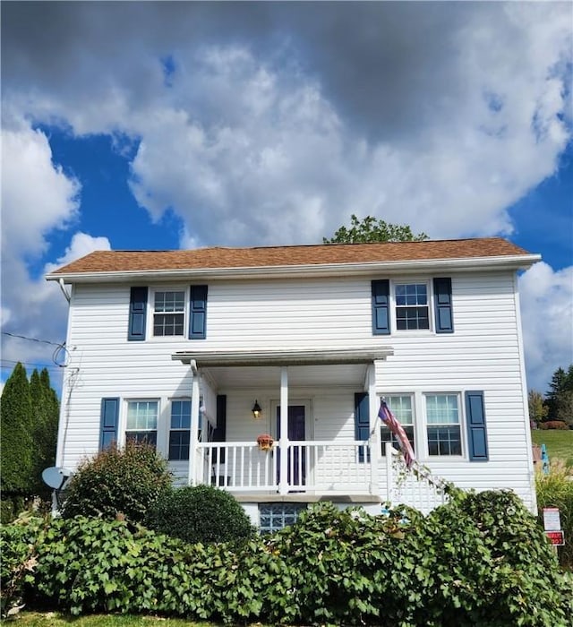 colonial inspired home with a porch