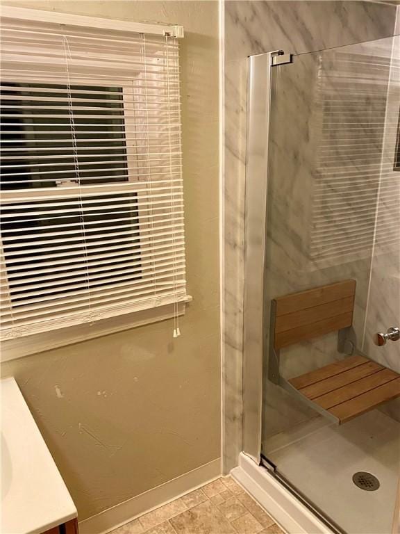 bathroom with a shower stall