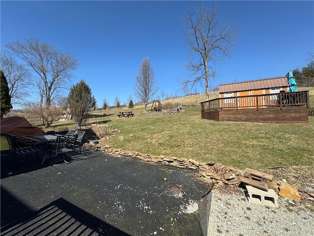 view of yard with a deck