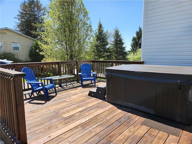deck featuring a hot tub