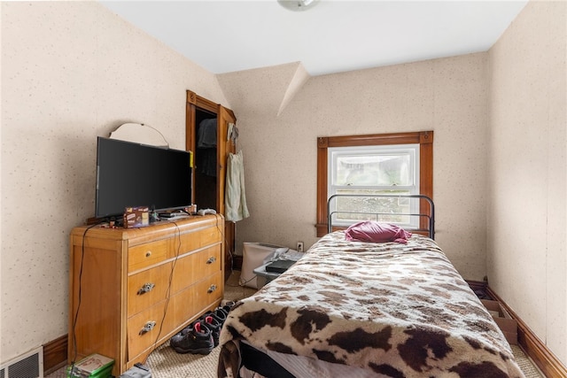 bedroom featuring lofted ceiling