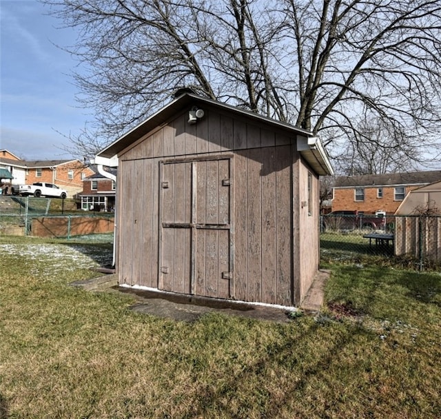 view of outdoor structure with a lawn