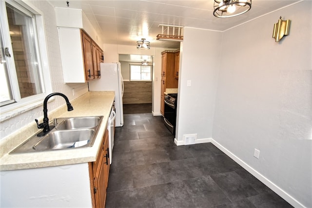 kitchen with dishwasher, stove, and sink