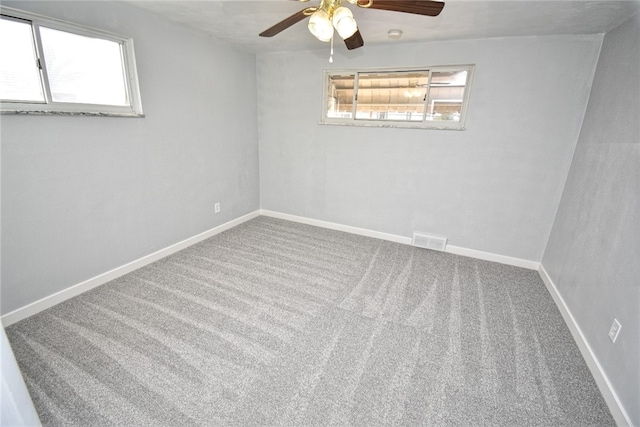 carpeted empty room with ceiling fan