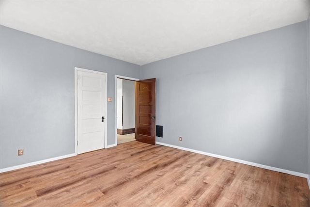 unfurnished room featuring light hardwood / wood-style floors