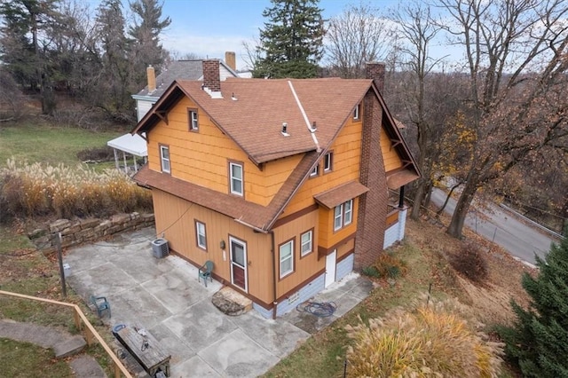 rear view of property featuring central AC unit