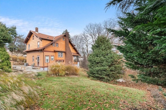 2035 Biggs Ave, Fineview, PA 15214 - back of property featuring a chimney, a patio area, and a lawn