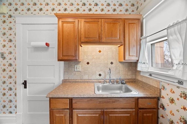 2035 Biggs Ave, Fineview, PA 15214 - kitchen with wallpapered walls, decorative backsplash, brown cabinetry, and light countertops