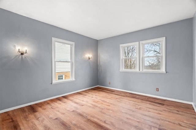 unfurnished room featuring light hardwood / wood-style floors