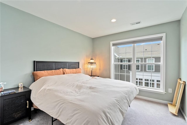 bedroom featuring light carpet