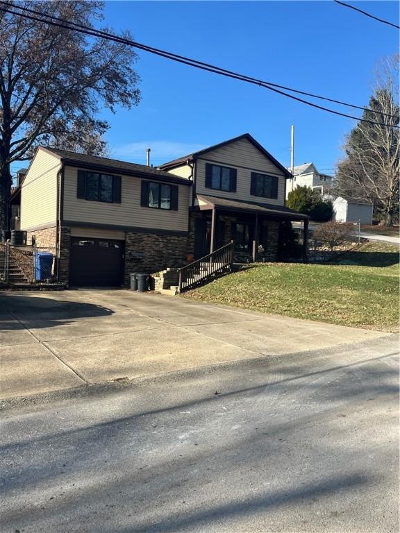 view of front of home with covered porch and a garage