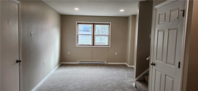 unfurnished room featuring light carpet and a baseboard radiator