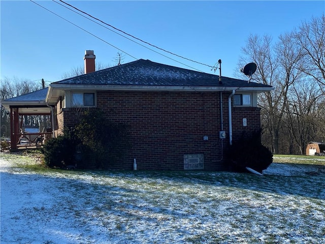 view of side of home with a lawn