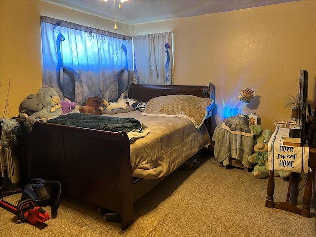 bedroom featuring light carpet