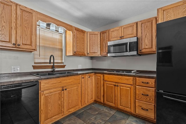 kitchen featuring sink and black appliances