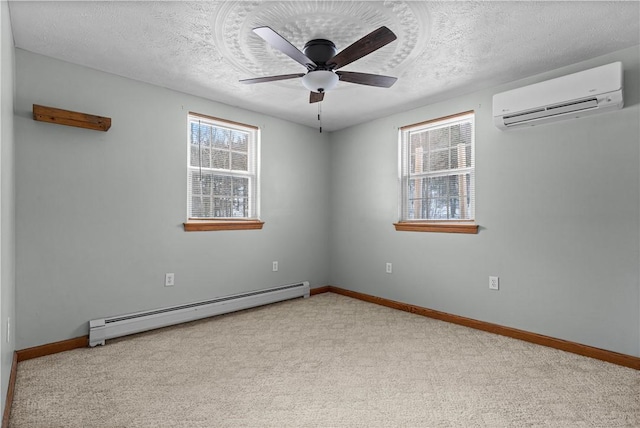 carpeted empty room with a textured ceiling, an AC wall unit, baseboard heating, and ceiling fan