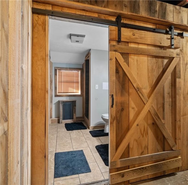 bathroom featuring tile patterned floors and toilet