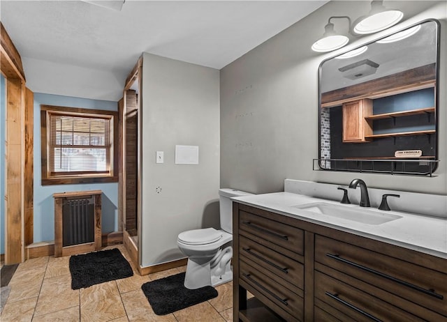 bathroom with radiator heating unit, walk in shower, tile patterned flooring, toilet, and vanity