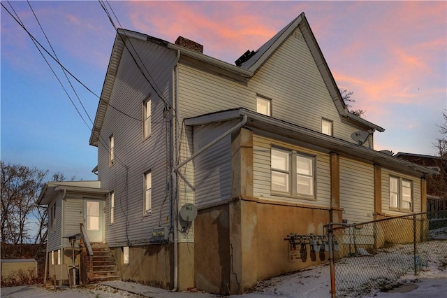 view of property exterior at dusk