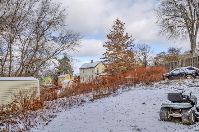 view of yard layered in snow