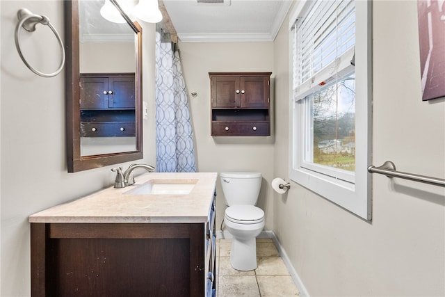 bathroom featuring tile patterned flooring, vanity, toilet, and crown molding