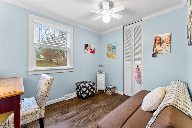 interior space with crown molding, ceiling fan, and dark wood-type flooring