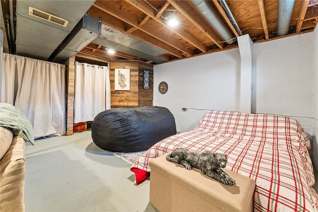 bedroom featuring concrete flooring