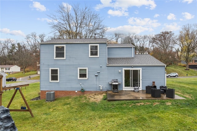 back of property with a lawn, central AC, an outdoor hangout area, a playground, and a patio