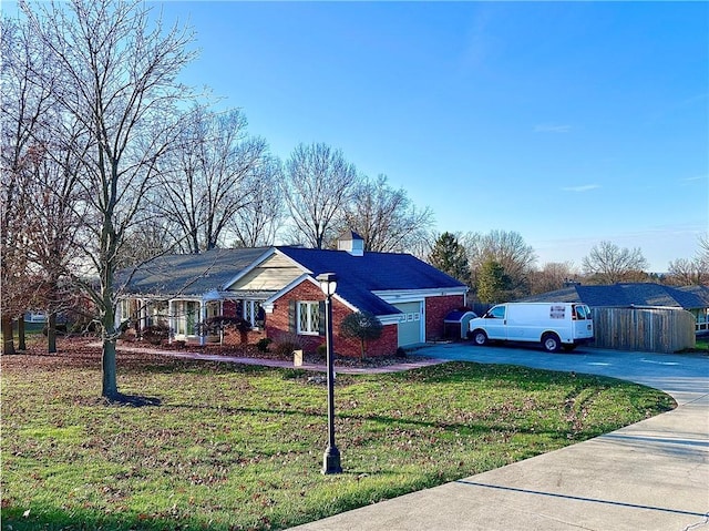 single story home with a garage and a front yard