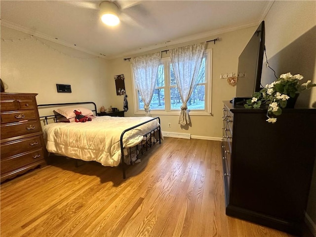 bedroom with baseboard heating, ceiling fan, crown molding, and light hardwood / wood-style floors