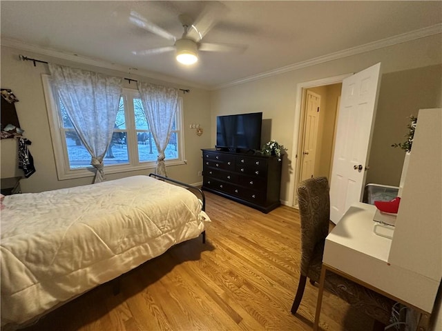 bedroom with ceiling fan, wood-type flooring, and ornamental molding