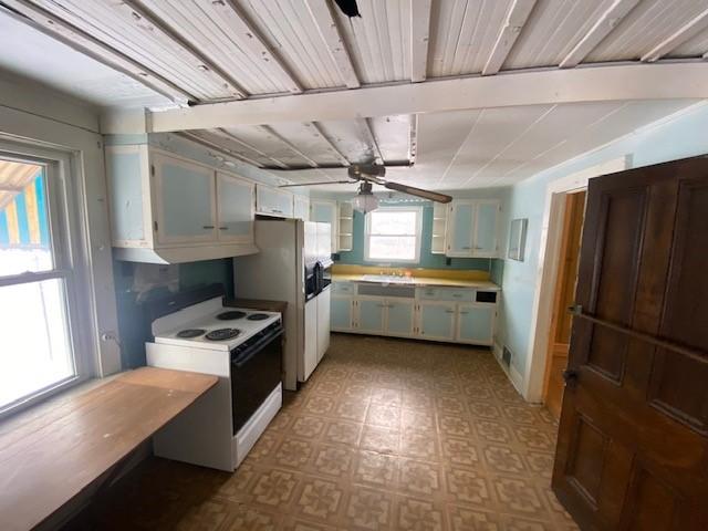 kitchen with white cabinets, white appliances, ceiling fan, and sink