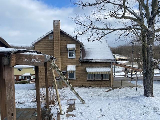 view of snow covered house