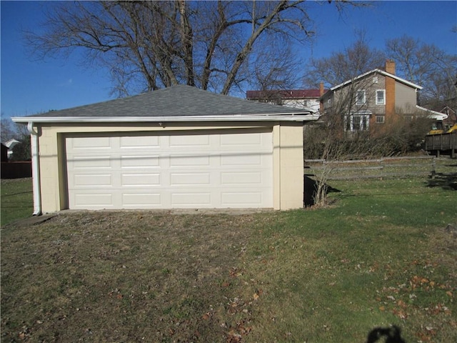 garage with a lawn